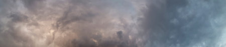 View of a stormy sky. A few sunbeams through the clouds.