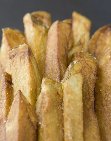 Close up of homemade french fries on grey background.の写真素材