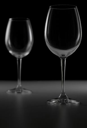 Two wine glasses on black background.の写真素材