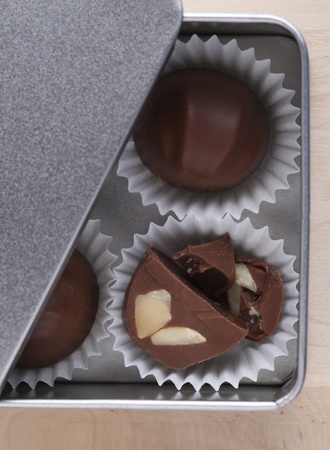 Chocolate candies in silver metal boxの写真素材