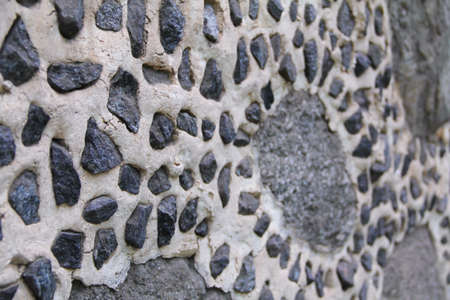 Decorative wall decoration of a house made of granite stones and cementの写真素材