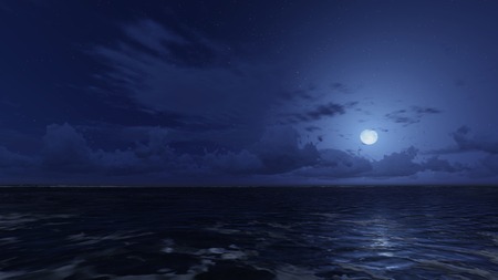 Calm ocean under starry night sky. Moonlight on the ocean surfaceの写真素材