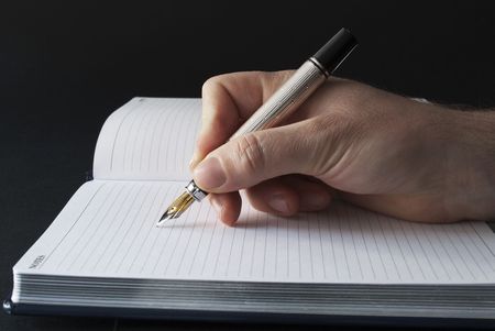 writing or signing on a blank agendaの写真素材