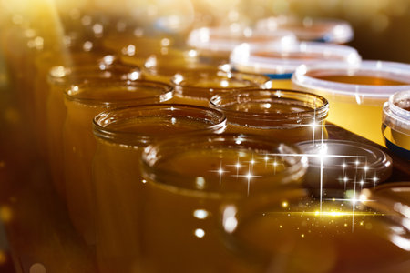 a jar of sweet honey in barrels are stored on a shelf in the pantry sweet food and delicious. High quality photoの写真素材