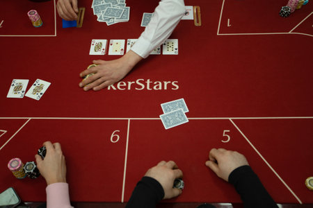 Texas club poker tournament which was in Ukraine in Kyiv in September 2020. Texas Holdem fans gathered together to play sports poker cards. High quality photoのeditorial素材