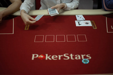 Texas club poker tournament which was in Ukraine in Kyiv in September 2020. Texas Holdem fans gathered together to play sports poker cards. High quality photoのeditorial素材
