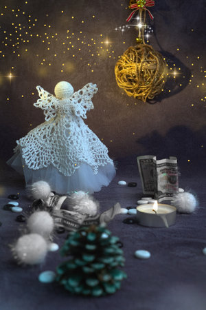wings candles bright with snow christmas angel creative and cozy picture background new year money dollars . High quality photoの写真素材