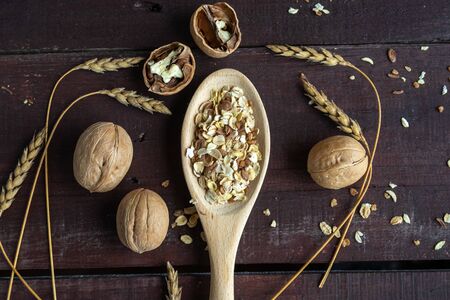 The wooden spoon in which the oatmeal is placed. Healthy lifestyle. Wooden spoon with oatmeal on a...