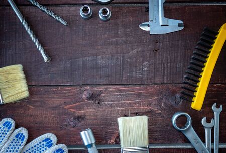 Construction tools on a wooden background. Space for your text. The view from the topの写真素材