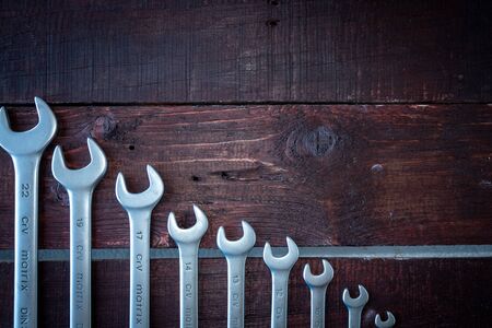 Construction tools on a wooden background. Space for your text. The view from the top