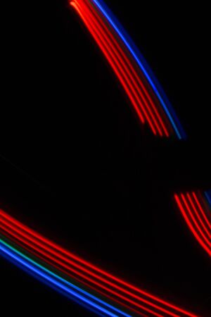 red-blue light lines on a black backgroundの写真素材