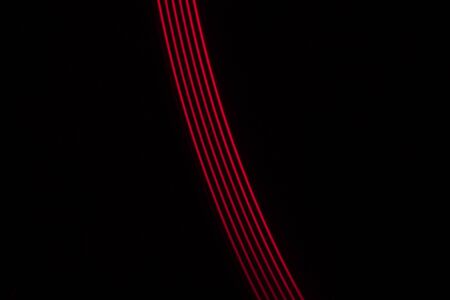 red light lines on a black background
