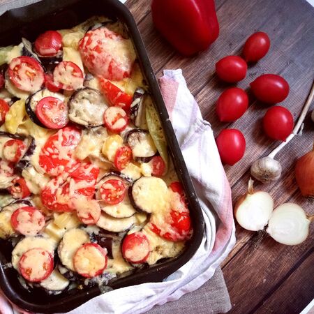 Roasted vegetables on dark wood backgroundの写真素材