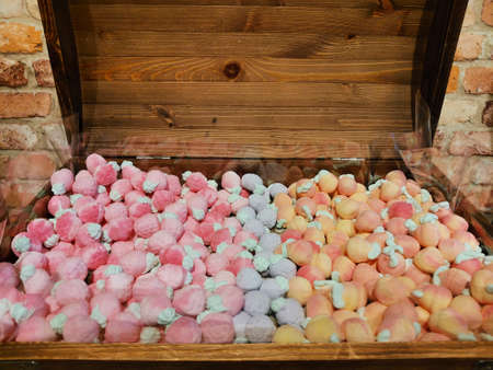 multi-coloured marshmallow candy in a wooden chest