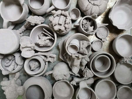 clay pots and crafts made of clay are dried and prepared for roasting