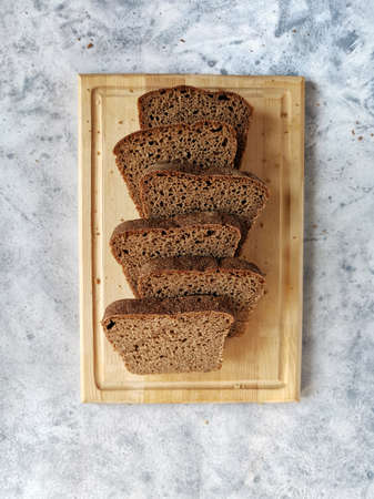 homemade rye bread on sourdough sliced on a wooden board