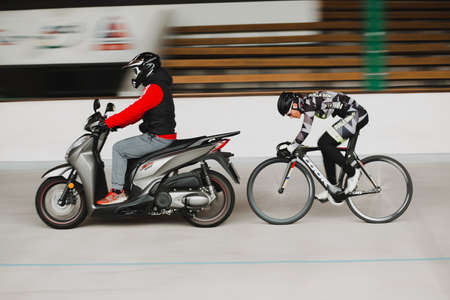 Riders on their vehicles.