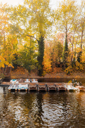 Boat on the river in autumn park. View from the boat.の写真素材
