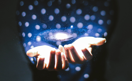 Holding the galaxyの写真素材
