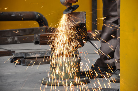 Sparks during working with steel in the factoryの写真素材