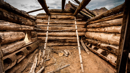 Old broken wood house in steppeの写真素材