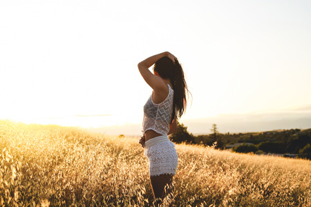 Girl in a field of white lace shorts