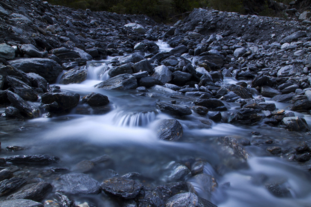A small waterfall on the rocksの写真素材