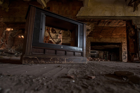 Old TV in an abandoned buildingの写真素材