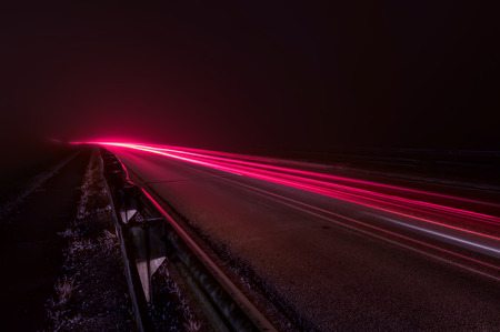 The red line on the road from a passing carの写真素材