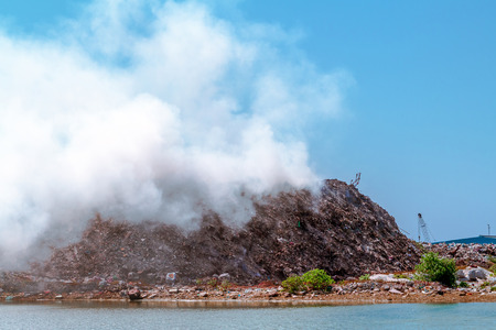 Steaming dump with garbageの写真素材