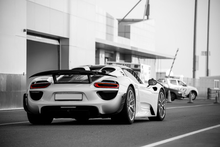 DUBAI, UAE - APRIL 15: Beautiful sportcar Porsche 918 Spyder with red taillights on the street.のeditorial素材