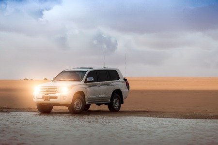 DUBAI, UAE - JUNE 22, 2016: White SUV Toyota Land Cruiser