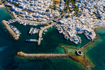 Aerial view of a Venetian castle ruin in the deep blue Mediterranean Sea, in front of the sea port Naoussa on the Greek island Parosの写真素材