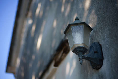 Street lamp on the wallの写真素材
