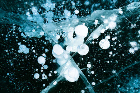 Cracked ice texture, abstract seasonal winter cold background, natural ice, broken ice on a lake