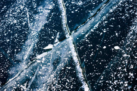 Frozen broken ice. Abstract ice floe image with Sun reflectionの写真素材