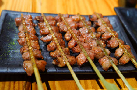 Closeup of chicken grilled for food saleの写真素材