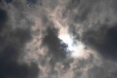 Gloomy clouds the sun through the clouds