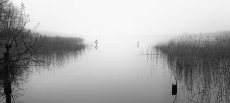 monochromatic foggy Lakeの写真素材