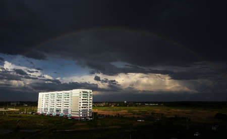 Rainbow in the stormy sky. The outskirts of the Russian city. Siberia. Omsk Photo: May 18, 2020.のeditorial素材