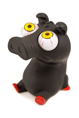 Funny pig toy (black), isolated on white backgroundの写真素材