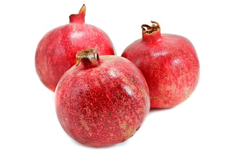 Ripe pomegranates isolated on white backgroundの写真素材
