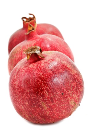 Ripe pomegranates isolated on white backgroundの写真素材