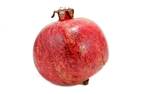 Ripe pomegranate isolated on white backgroundの写真素材