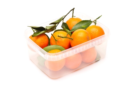 Ripe tangerines in plastic containerの写真素材