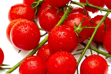 Ripe cherry tomatoes on white backgroundの写真素材