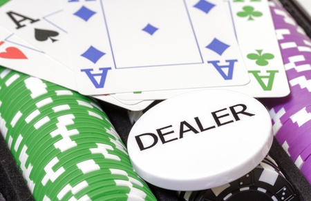 Set of poker chips, cards and dealer button closeupの写真素材