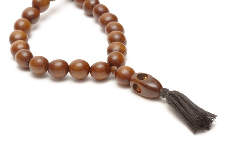 Wooden rosary on white backgroundの写真素材