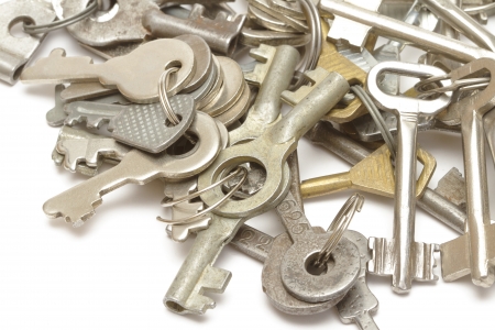Heap of keys on whiteの写真素材