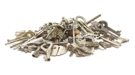 Heap of keys on whiteの写真素材
